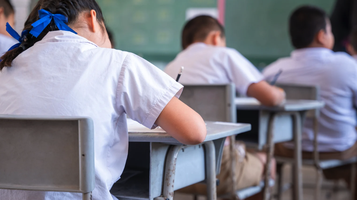 Thai K-12 students at their desks in class